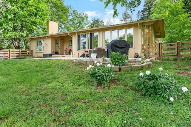 209 Woods Dr, Columbia, TN 38401 - rear view of house with a chimney and a patio