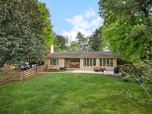 209 Woods Dr, Columbia, TN 38401 - back of property featuring a patio area, a chimney, and stucco siding