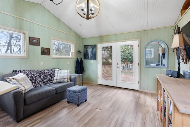 209 Woods Dr, Columbia, TN 38401 - living room with vaulted ceiling, a chandelier, wood finished floors, french doors, and baseboards