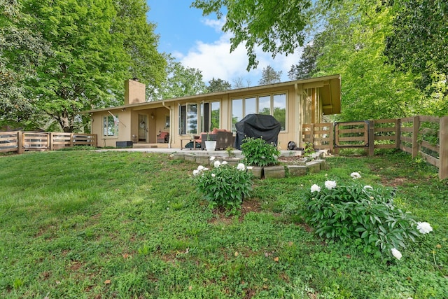 209 Woods Dr, Columbia, TN 38401 - back of house with a chimney and a patio