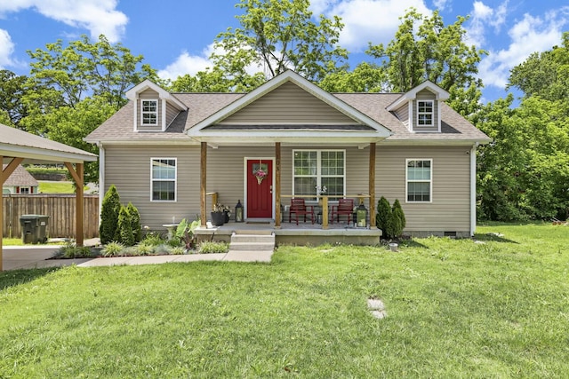 103 Lockhart St, Dickson, TN 37055 - view of front of house with covered porch, a shingled roof, and a front lawn