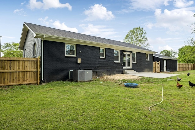 176 Morningside Dr, La Vergne, TN 37086 - rear view of house featuring entry steps, central AC, brick siding, and a patio