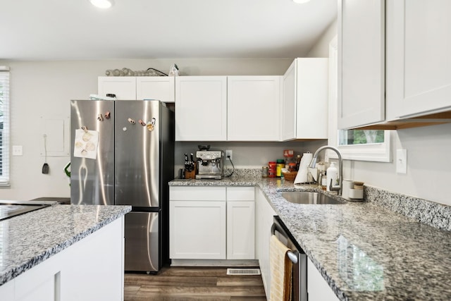 176 Morningside Dr, La Vergne, TN 37086 - kitchen with appliances with stainless steel finishes, a sink, dark wood-style floors, and white cabinetry