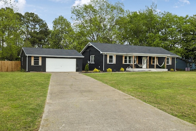 176 Morningside Dr, La Vergne, TN 37086 - ranch-style house featuring covered porch, an outdoor structure, a garage, and driveway