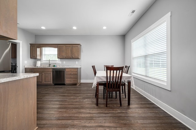 1130 Ferrells Loop Rd, Beechgrove, TN 37018 - kitchen with stainless steel dishwasher, a sink, dark wood finished floors, light countertops, and recessed lighting