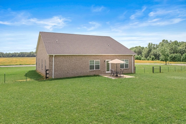 1130 Ferrells Loop Rd, Beechgrove, TN 37018 - back of house featuring a patio area, brick siding, and roof with shingles