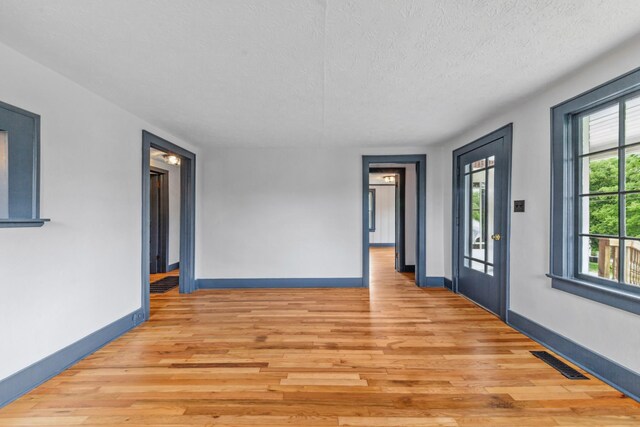 512 Transit Ave, Columbia, TN 38401 - spare room with light wood-type flooring, baseboards, and a textured ceiling