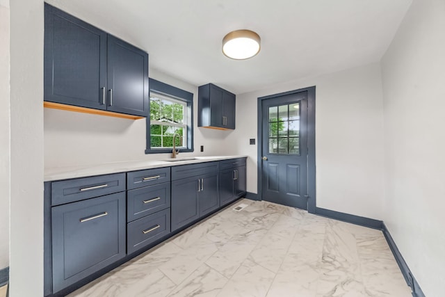 512 Transit Ave, Columbia, TN 38401 - kitchen featuring a sink, light marble finish floors, light countertops, and healthy amount of natural light