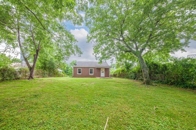 512 Transit Ave, Columbia, TN 38401 - view of green lawn with an outbuilding
