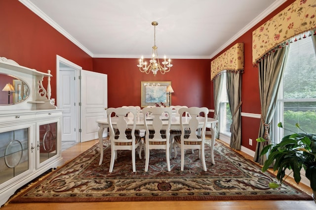 2305 Black Fox Ct, Murfreesboro, TN 37127 - dining area with a chandelier, crown molding, and light wood-type flooring
