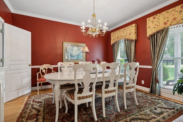 2305 Black Fox Ct, Murfreesboro, TN 37127 - dining area with light wood-style floors, a chandelier, ornamental molding, and baseboards