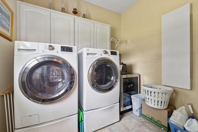 2305 Black Fox Ct, Murfreesboro, TN 37127 - laundry area featuring beverage cooler, cabinet space, and washer and clothes dryer