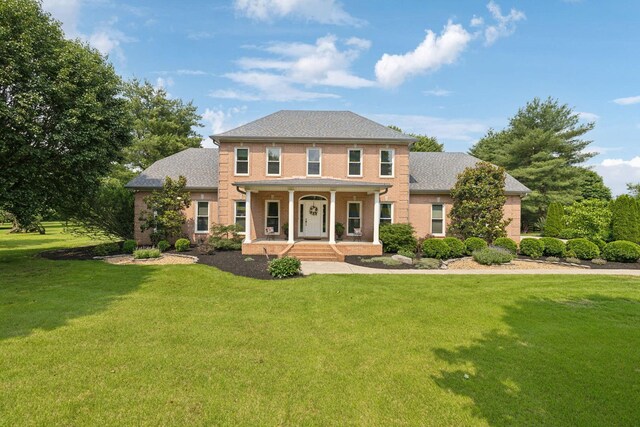 2305 Black Fox Ct, Murfreesboro, TN 37127 - colonial home with a porch, a front yard, and brick siding