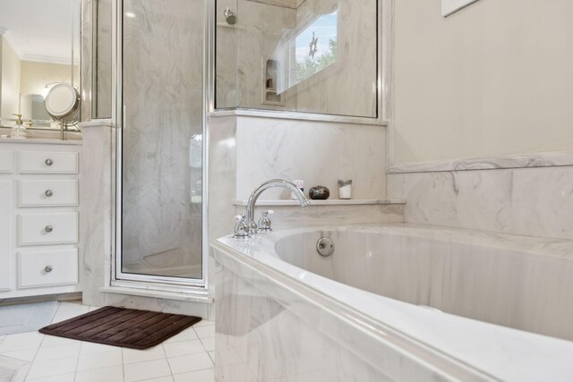 2305 Black Fox Ct, Murfreesboro, TN 37127 - bathroom featuring vanity, a marble finish shower, a bath, tile patterned floors, and ornamental molding