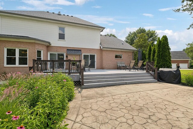 2305 Black Fox Ct, Murfreesboro, TN 37127 - rear view of house featuring brick siding and a wooden deck
