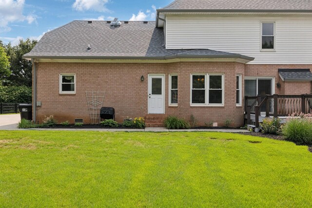 2305 Black Fox Ct, Murfreesboro, TN 37127 - back of house featuring a lawn, entry steps, brick siding, and a wooden deck