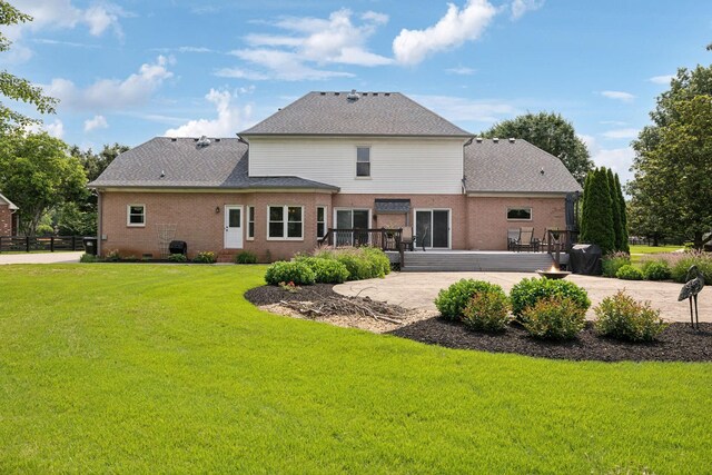 2305 Black Fox Ct, Murfreesboro, TN 37127 - rear view of house featuring a deck, brick siding, and a shingled roof