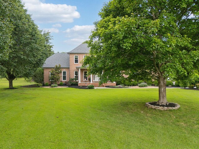 2305 Black Fox Ct, Murfreesboro, TN 37127 - view of front facade with a front lawn, brick siding, and roof with shingles