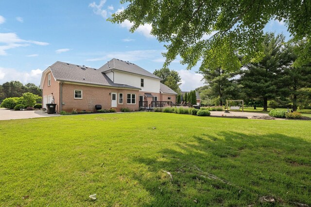 2305 Black Fox Ct, Murfreesboro, TN 37127 - back of house with brick siding, a lawn, and an attached garage