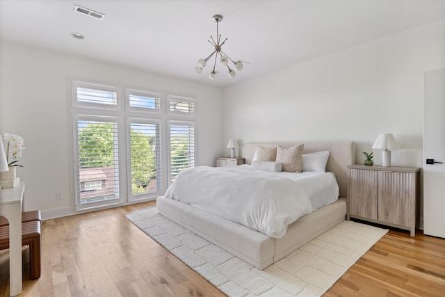 814A Horner Ave, Nashville, TN 37204 - bedroom featuring a chandelier, light wood-style flooring, and baseboards