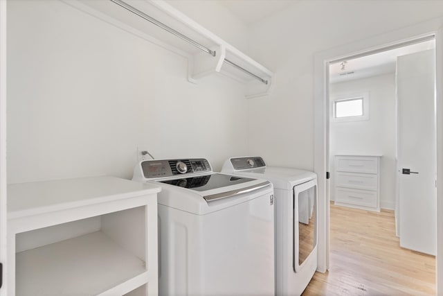 814A Horner Ave, Nashville, TN 37204 - clothes washing area featuring washing machine and dryer and light wood-style flooring