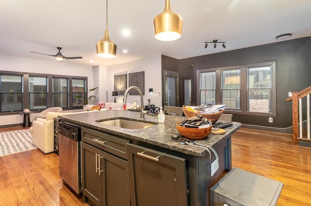 3802B Hutson Ave, Nashville, TN 37216 - kitchen featuring stainless steel dishwasher, a sink, open floor plan, light wood-style floors, and hanging light fixtures