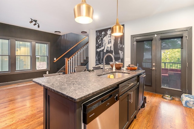 3802B Hutson Ave, Nashville, TN 37216 - kitchen featuring a sink, dishwasher, light wood-type flooring, decorative light fixtures, and a kitchen island with sink