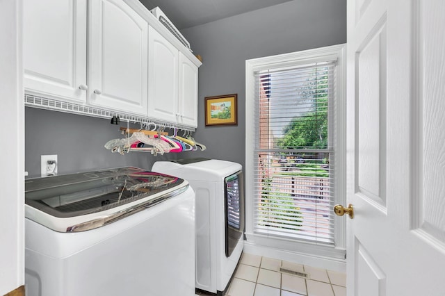 113 Abbeywood Dr, Nashville, TN 37215 - clothes washing area with separate washer and dryer, cabinet space, and light tile patterned floors