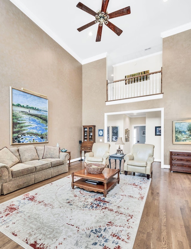 113 Abbeywood Dr, Nashville, TN 37215 - living area featuring a towering ceiling, a ceiling fan, ornamental molding, wood finished floors, and baseboards