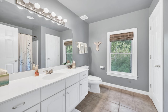 113 Abbeywood Dr, Nashville, TN 37215 - bathroom with baseboards, plenty of natural light, toilet, and vanity