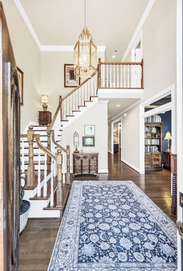 113 Abbeywood Dr, Nashville, TN 37215 - foyer entrance featuring a chandelier, stairs, ornamental molding, wood finished floors, and a high ceiling
