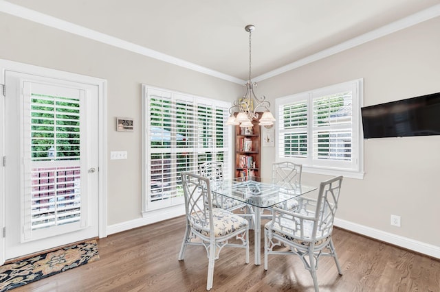 113 Abbeywood Dr, Nashville, TN 37215 - dining space featuring ornamental molding, wood finished floors, a chandelier, baseboards, and healthy amount of natural light