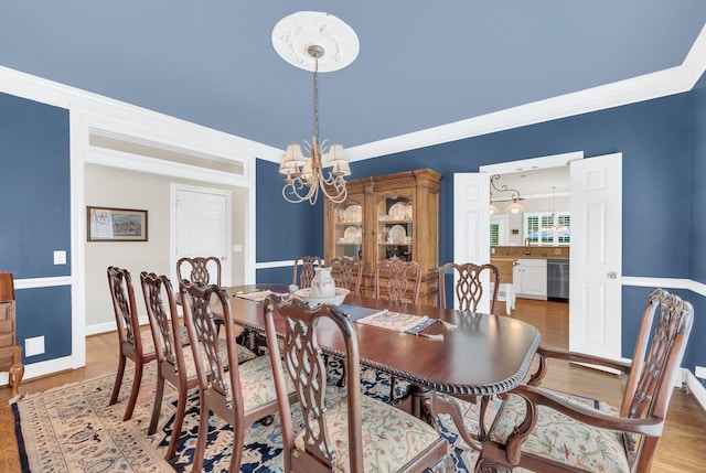 113 Abbeywood Dr, Nashville, TN 37215 - dining room with a chandelier, light wood-type flooring, and baseboards