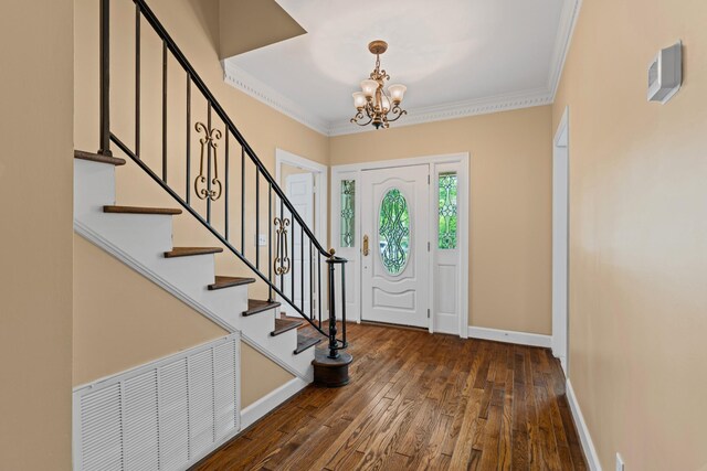 55 Revere Park, Nashville, TN 37205 - entryway featuring hardwood / wood-style flooring, a chandelier, baseboards, stairs, and crown molding