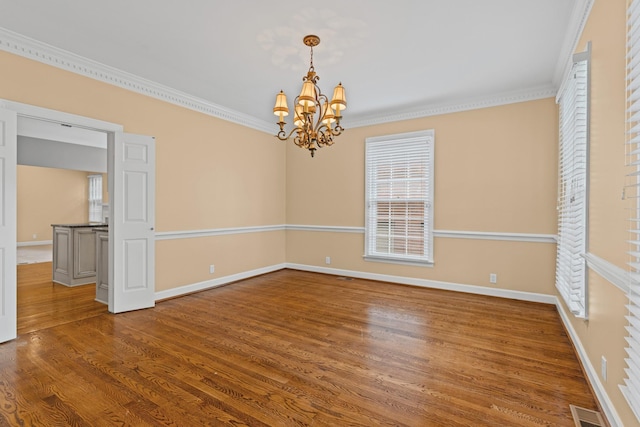 55 Revere Park, Nashville, TN 37205 - empty room with a chandelier, healthy amount of natural light, wood finished floors, and ornamental molding