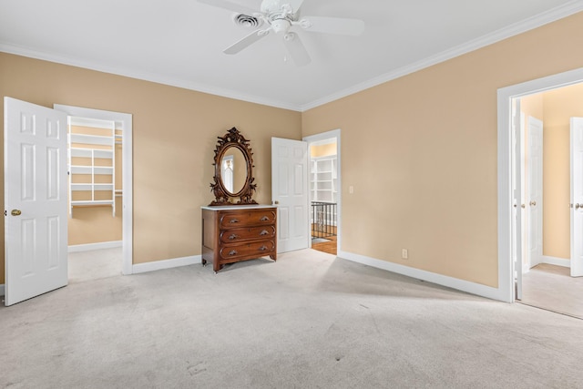 55 Revere Park, Nashville, TN 37205 - bedroom featuring crown molding, carpet flooring, baseboards, a walk in closet, and a closet