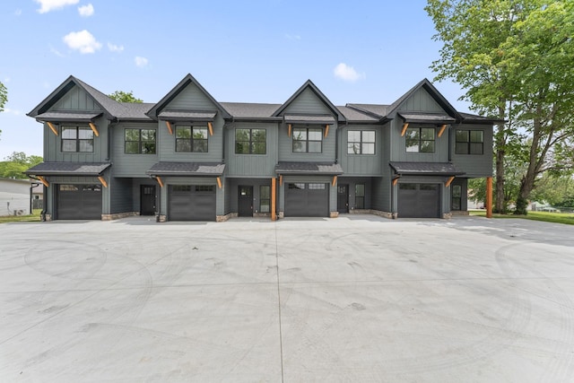 217 S Porter St S Unit 217, Winchester, TN 37398 - view of property with an attached garage, board and batten siding, stone siding, and driveway