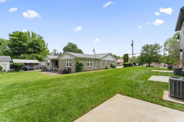 217 S Porter St S Unit 217, Winchester, TN 37398 - view of grassy yard with a patio area and central AC