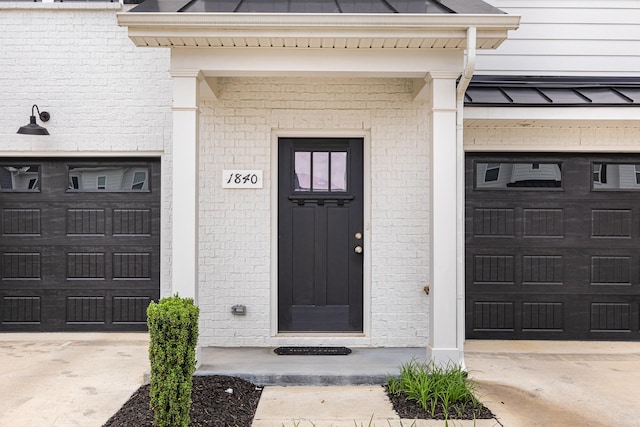 1840 Bethpage Dr, Murfreesboro, TN 37127 - view of exterior entry featuring concrete driveway, brick siding, and an attached garage
