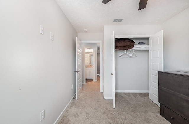 1840 Bethpage Dr, Murfreesboro, TN 37127 - unfurnished bedroom with light carpet, baseboards, a closet, a textured ceiling, and ceiling fan