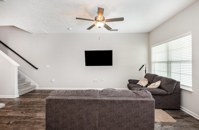 1840 Bethpage Dr, Murfreesboro, TN 37127 - living area with dark wood finished floors, baseboards, stairway, and a ceiling fan