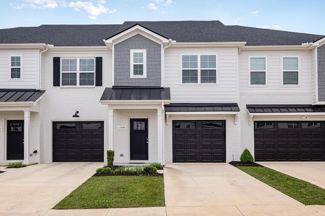 1840 Bethpage Dr, Murfreesboro, TN 37127 - townhome / multi-family property with a garage, a standing seam roof, brick siding, and driveway