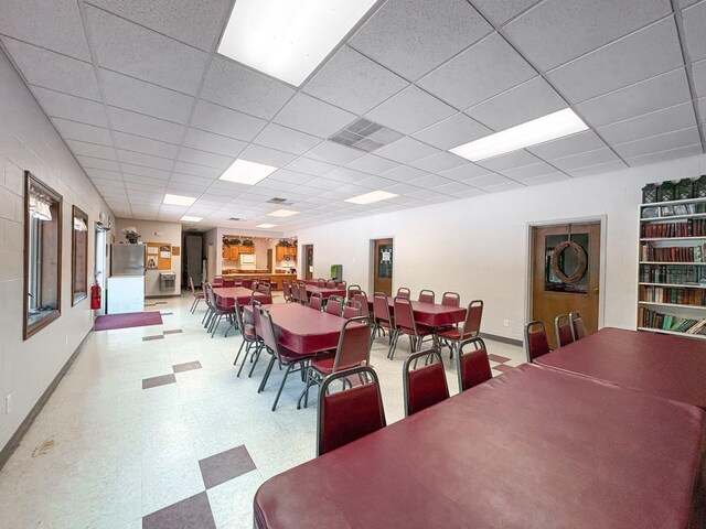 110 Hankins Rd, Hohenwald, TN 38462 - dining space featuring tile patterned floors, baseboards, and a drop ceiling