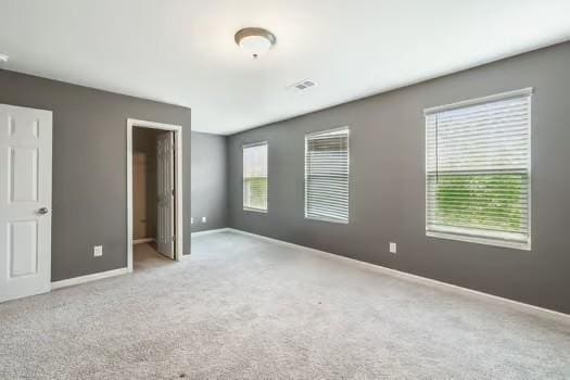 1470 Old Stone Rd, Lebanon, TN 37087 - unfurnished bedroom with carpet floors, baseboards, and a walk in closet