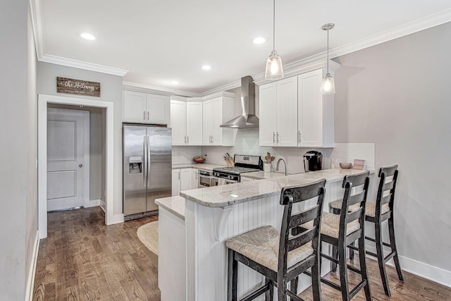6214A California Ave, Nashville, TN 37209 - kitchen with stainless steel appliances, wall chimney exhaust hood, crown molding, a peninsula, and decorative backsplash