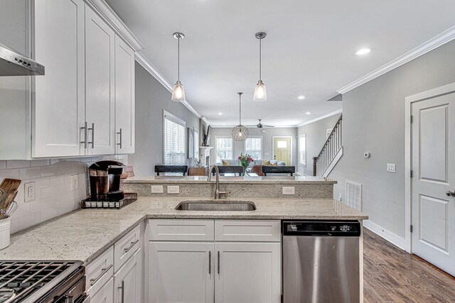 6214A California Ave, Nashville, TN 37209 - kitchen featuring stainless steel dishwasher, a sink, crown molding, a peninsula, and open floor plan