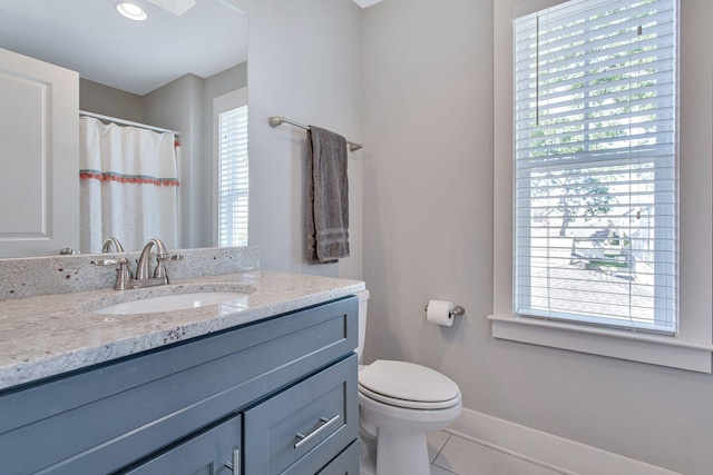 6214A California Ave, Nashville, TN 37209 - full bath featuring plenty of natural light, toilet, vanity, and tile patterned flooring