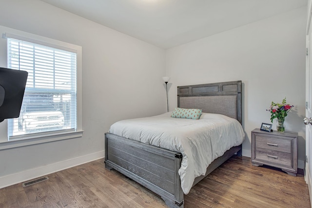 6214A California Ave, Nashville, TN 37209 - bedroom with multiple windows, baseboards, and wood finished floors