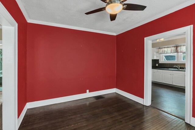 521 E Eastland St, Gallatin, TN 37066 - empty room featuring dark wood-style floors, a ceiling fan, a textured ceiling, baseboards, and a sink