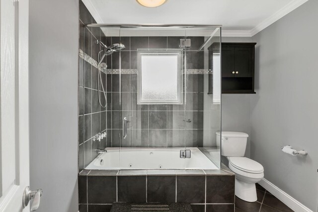 521 E Eastland St, Gallatin, TN 37066 - full bathroom with toilet, a combined bath / shower with jetted tub, ornamental molding, tile patterned flooring, and baseboards